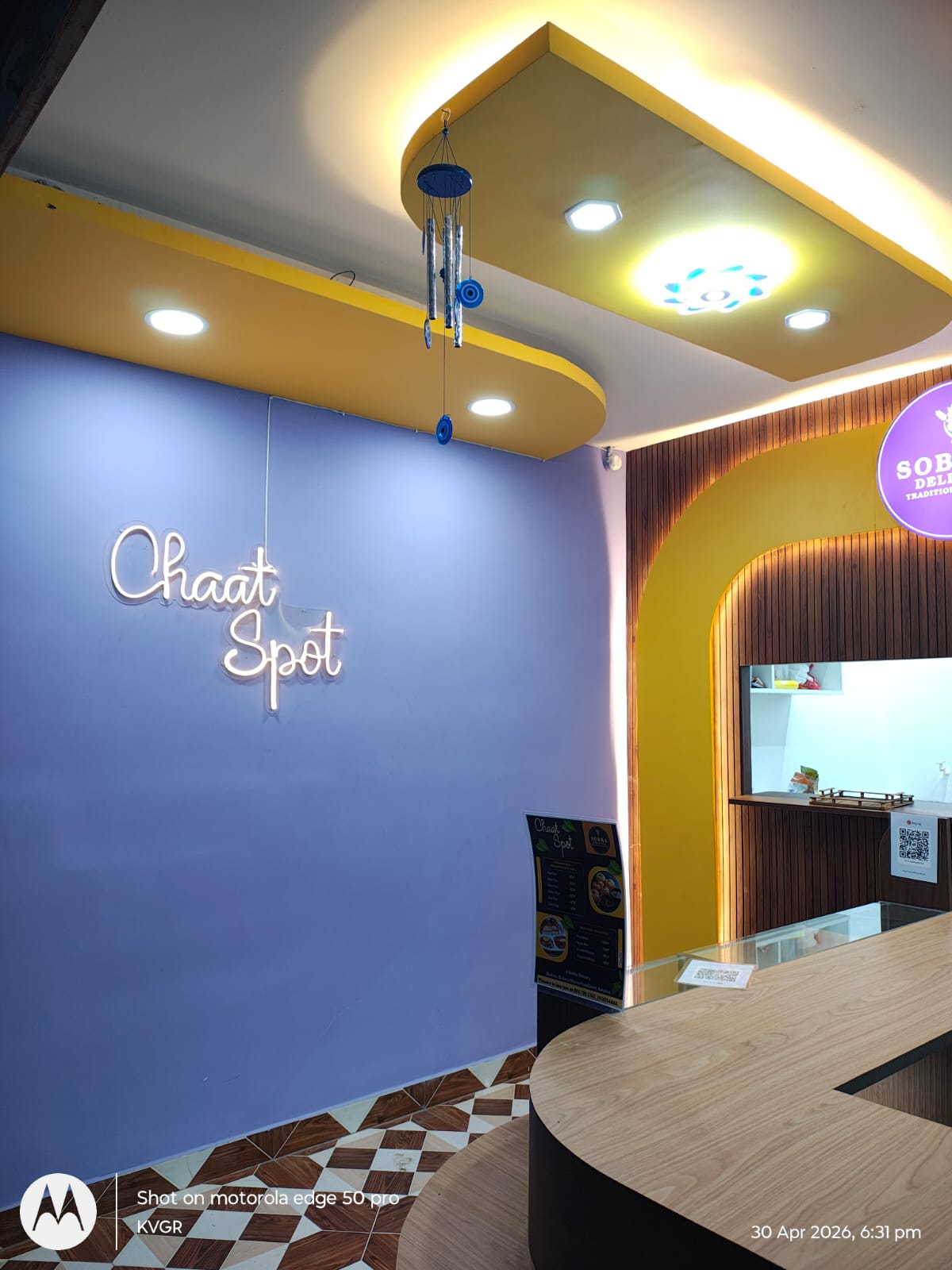 Chaat Spot neon wall and interior